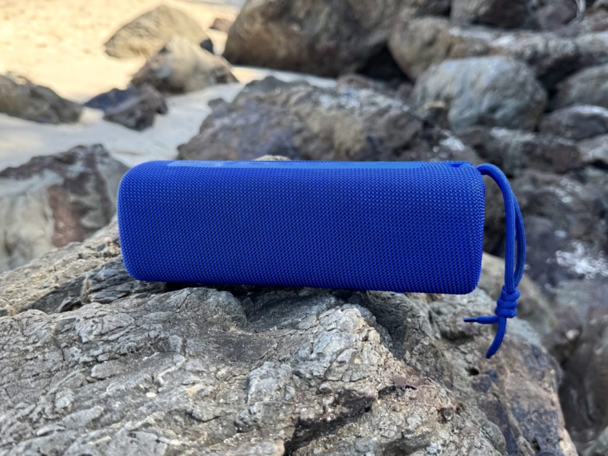 Portable speaker on a rock by the sea